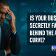 Businessman in a high-tech office appearing thoughtful, with AI graphics in the background and text asking if businesses are falling behind the AI curve.