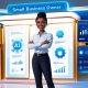 Confident Black female small business owner stands in front of AI-powered marketing dashboard with digital growth metrics