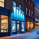 Local storefront glowing with futuristic blue AI graphics and upward-trending marketing data visuals, symbolizing small business growth.